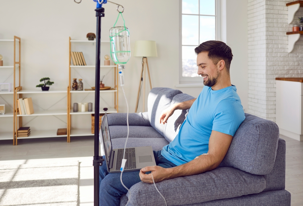 Young,Man,Sitting,On,Sofa,And,Having,Online,Video,Call